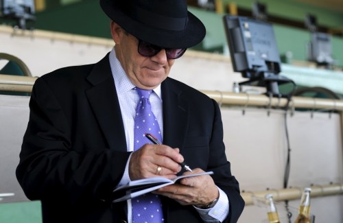 Henry "The Horse" Weinstein makes notes on his next wager. 