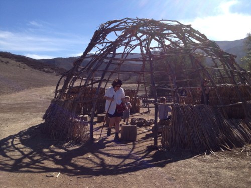 Victoria explores a traditional Chumash dwelling at the Satwiwa Native American Indian Cultural Center.